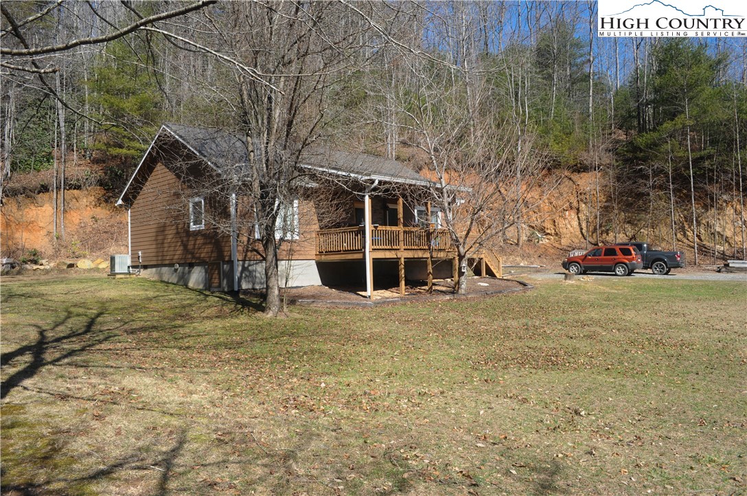 4935 Wildcat Road Deep Gap, NC 28618 - Photo 3 of 33 a view of a house with a yard