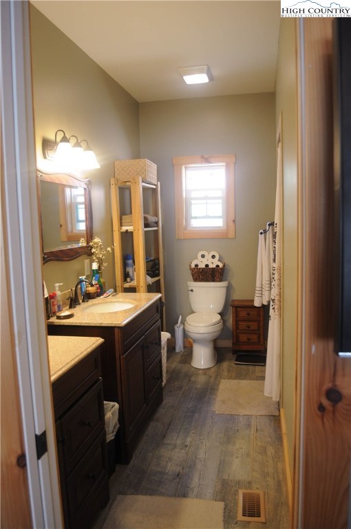 4935 Wildcat Road Deep Gap, NC 28618 - Photo 32 of 33 a spacious bathroom with a bathtub sink mirror and toilet