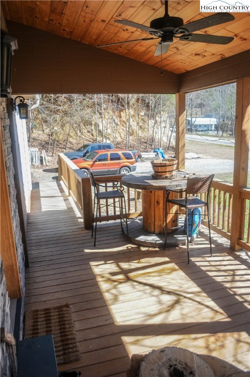 4935 Wildcat Road Deep Gap, NC 28618 - Photo 8 of 33 a view of a patio with a table and chairs