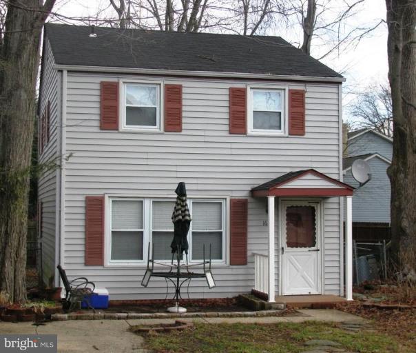 1619 Ruxton Road Edgewater, MD 21037 - Photo 1 of 10 a front view of a house with garage