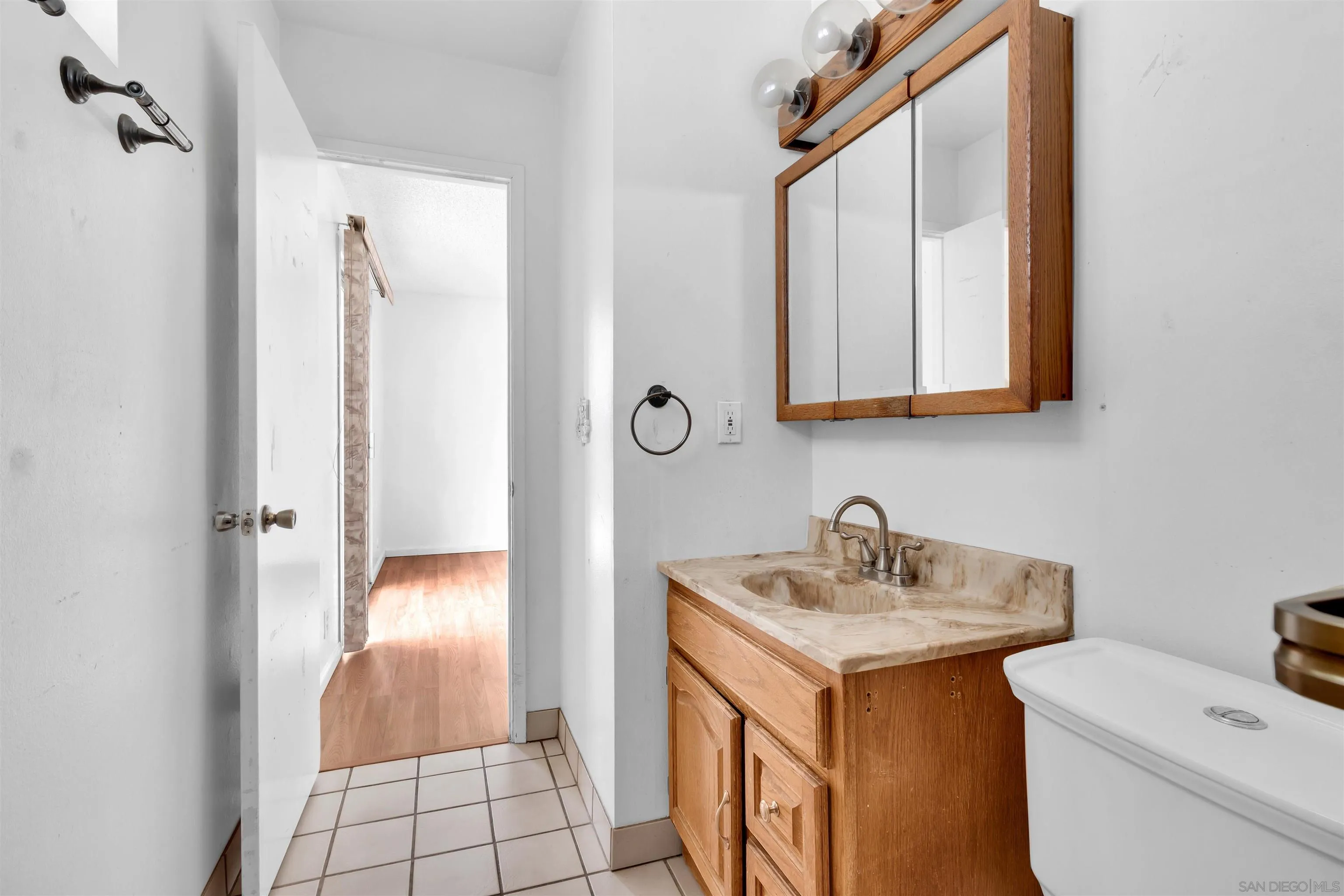 901 St George Court Spring Valley, CA 91977 - Photo 18 of 32 a bathroom with a sink and a mirror