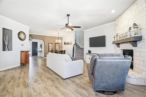 a kitchen with a table chairs refrigerator and cabinets
