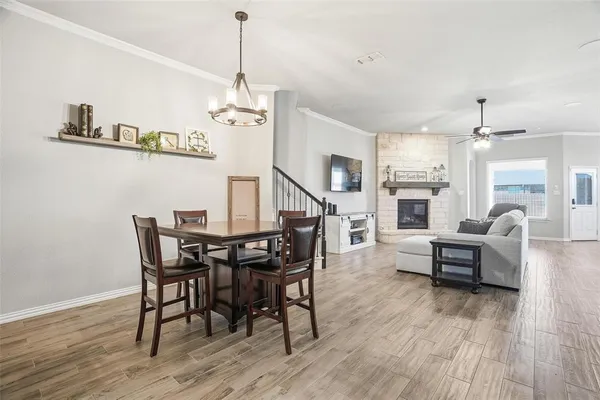 a kitchen with sink cabinets and dining table chair