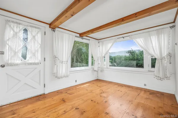 a view of room with window and outdoor view