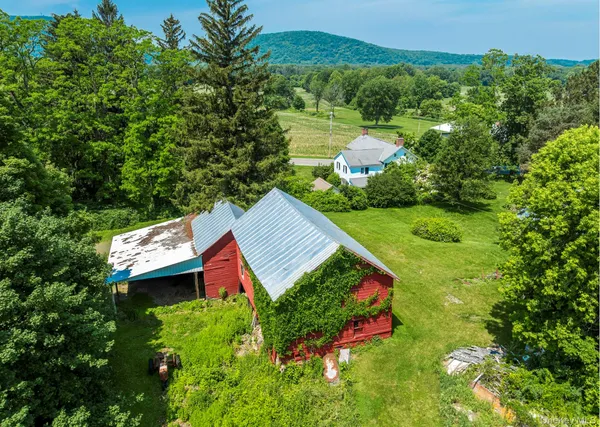 an aerial view of residential house with outdoor space and swimming pool