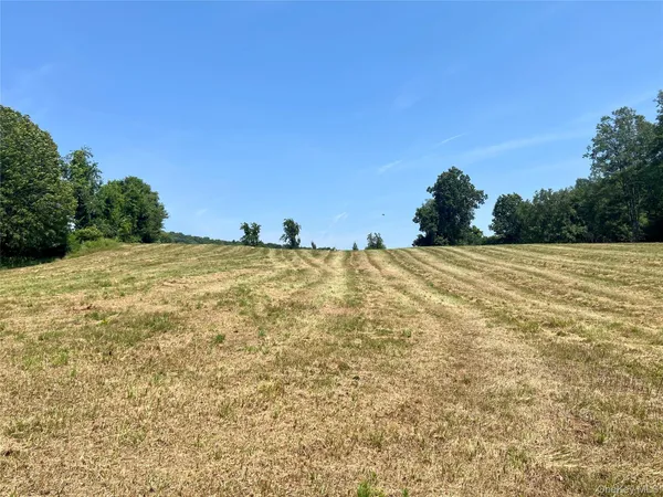a view of a large body of water with a building in the background