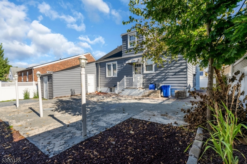 2144 Tyler Street Union, NJ 07083 - Photo 15 of 21 a front view of a house with garden