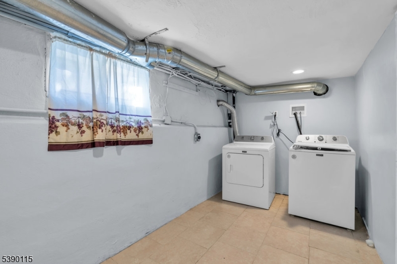 2144 Tyler Street Union, NJ 07083 - Photo 18 of 21 a view of storage and utility room with washer and dryer
