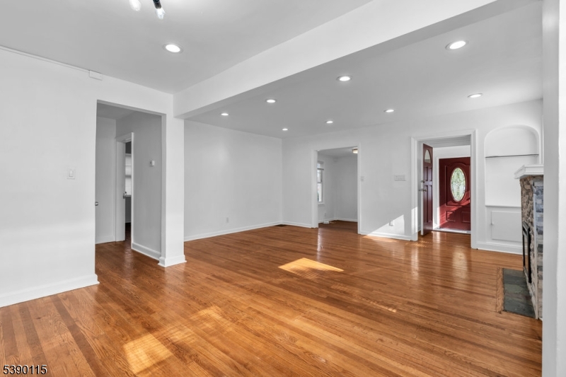 2144 Tyler Street Union, NJ 07083 - Photo 3 of 21 a view of an empty room with wooden floor