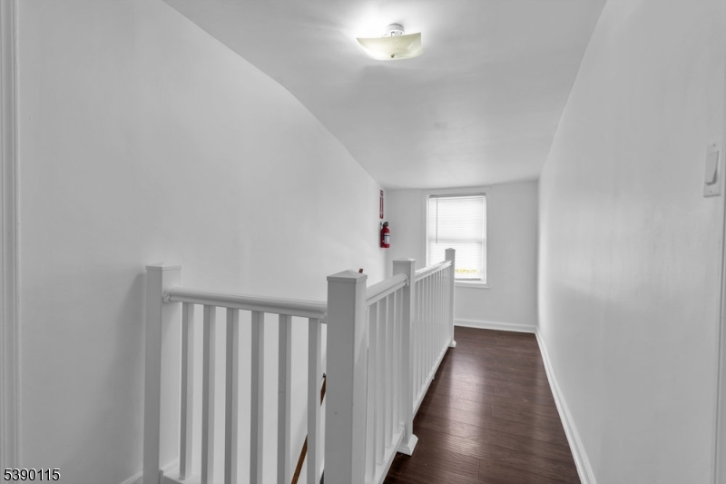 2144 Tyler Street Union, NJ 07083 - Photo 10 of 21 a view of a hallway with wooden floor