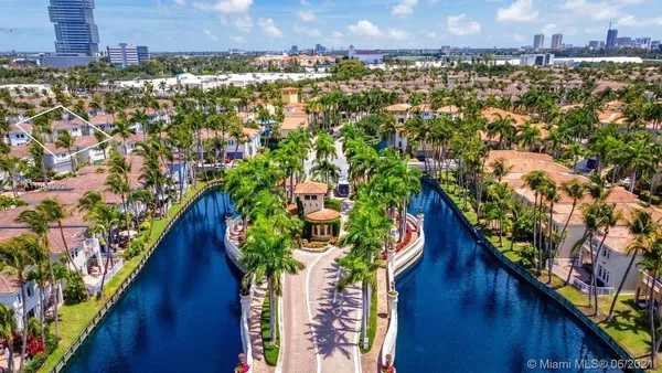 an aerial view of residential houses with outdoor space and garden