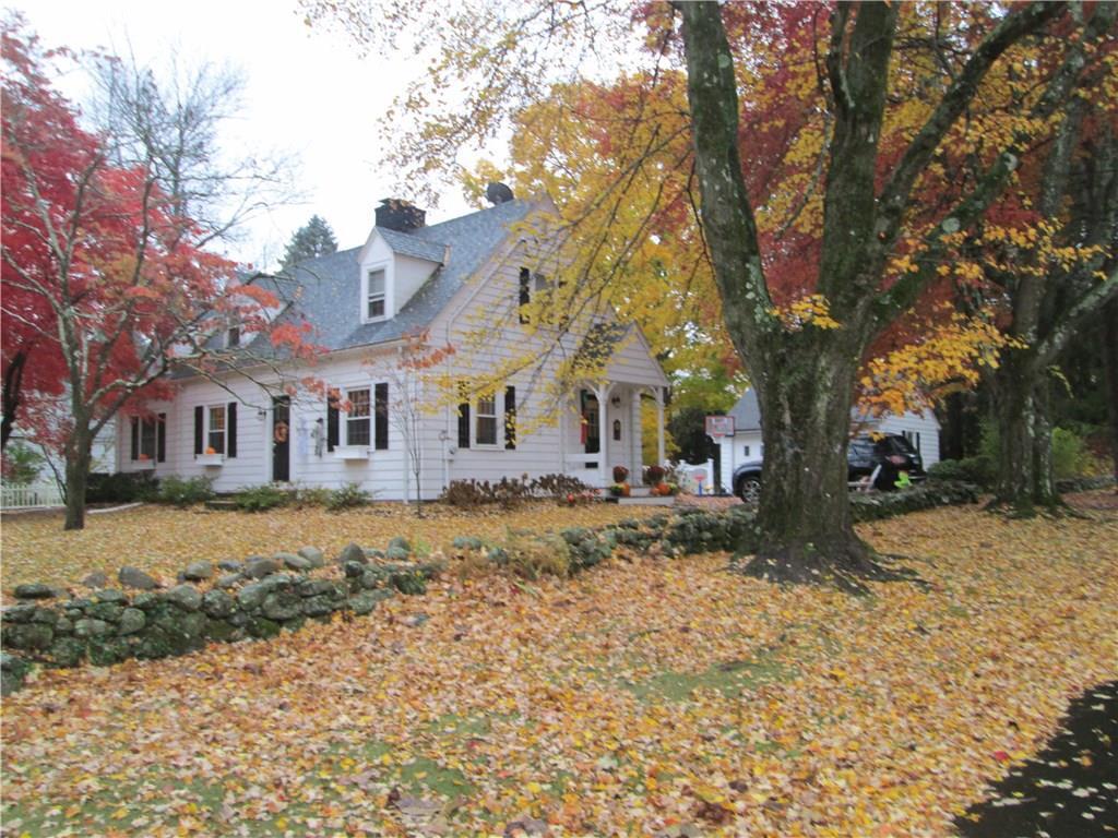1182 Johnson Road Woodbridge, CT 06525 - Photo 1 of 1 a front view of a house with a yard covered in snow
