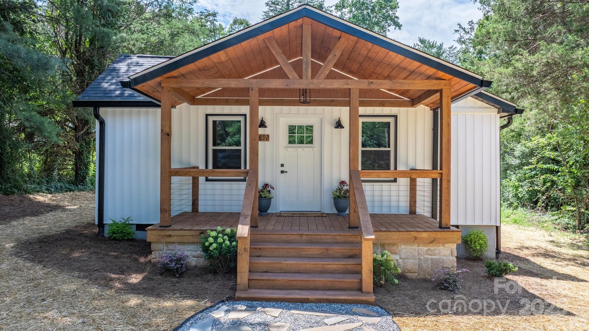 4892 Charlie Crawley Road Morganton, NC 28655 - Photo 1 of 37 a front view of a house with garden