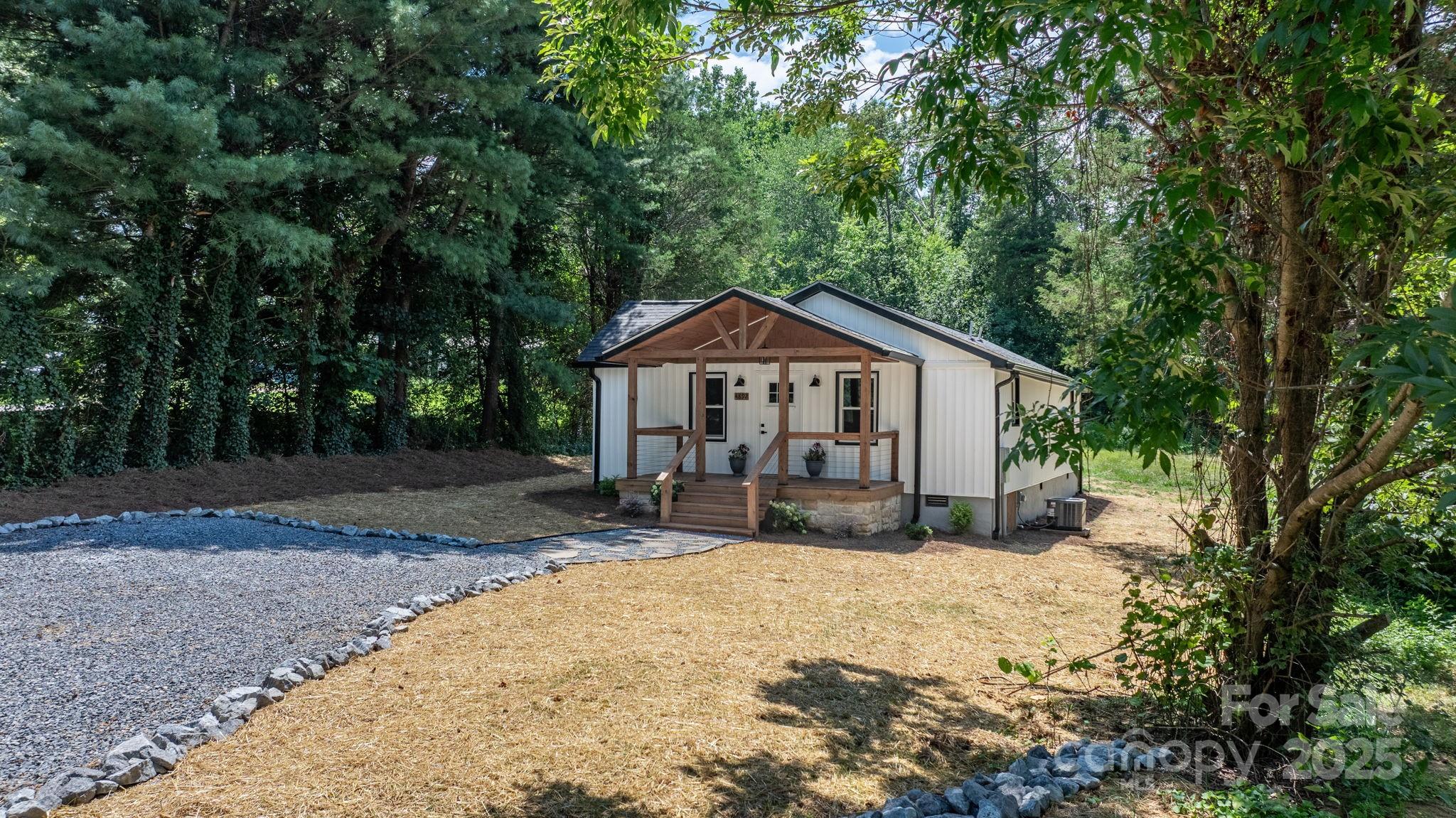 4892 Charlie Crawley Road Morganton, NC 28655 - Photo 33 of 37 a front view of a house with yard and sitting area