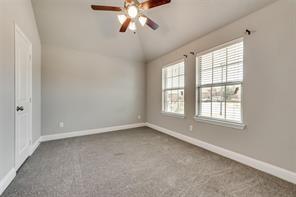 698 Harper Drive Fate, TX 75087 - Photo 14 of 18 an empty room with windows and fan