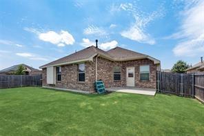 698 Harper Drive Fate, TX 75087 - Photo 16 of 18 a front view of a house with garden
