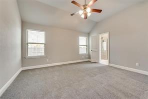 698 Harper Drive Fate, TX 75087 - Photo 8 of 18 an empty room with chandelier fan and windows