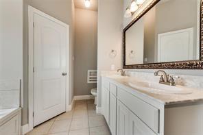 698 Harper Drive Fate, TX 75087 - Photo 9 of 18 a bathroom with a sink and a toilet
