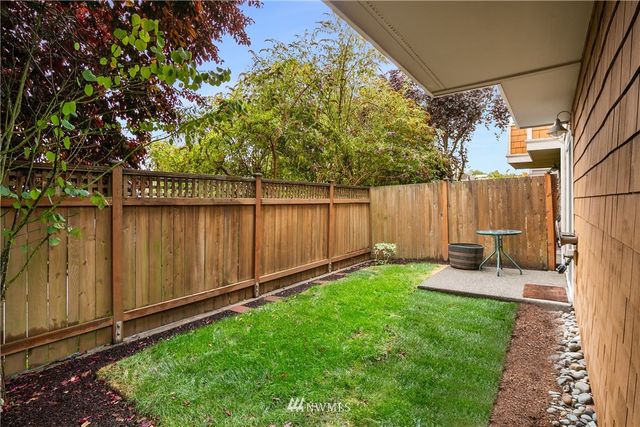 a view of yard with patio