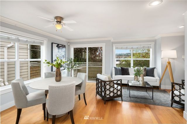 a dining room with furniture and wooden floor