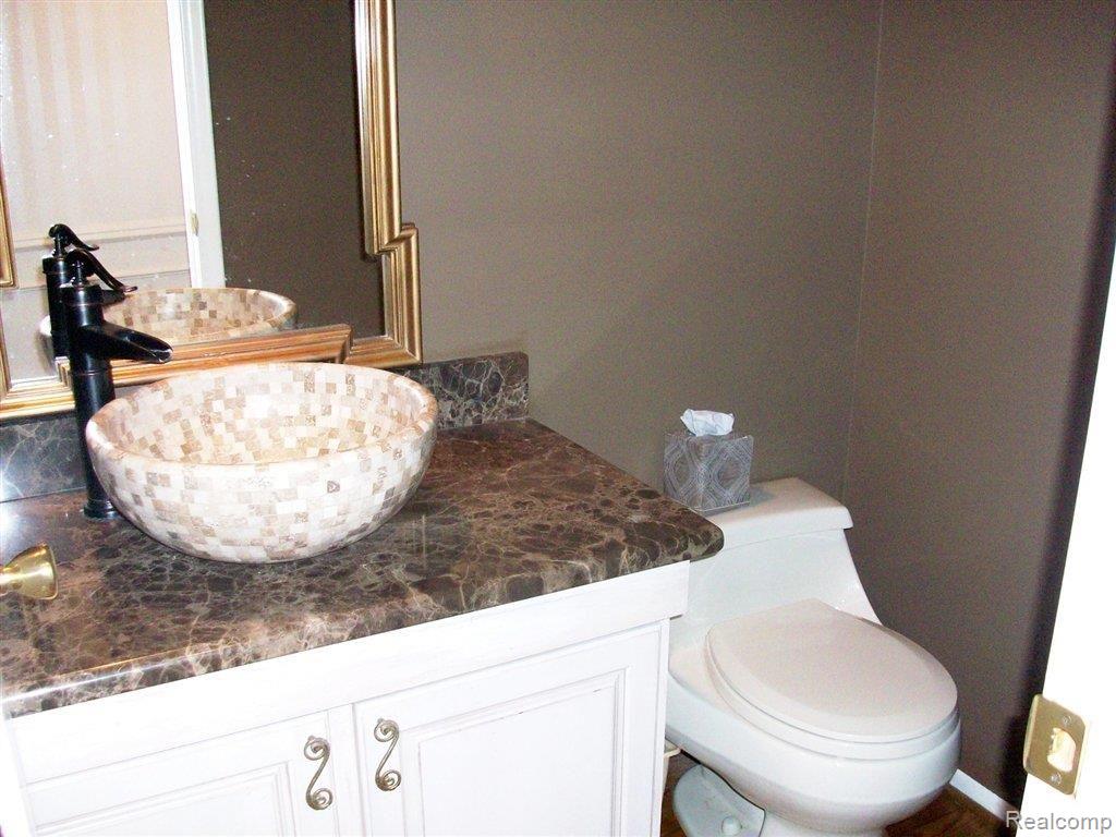 716 Bridgestone Drive Rochester, MI 48309 - Photo 13 of 23 Bridgestone powder room.jpg