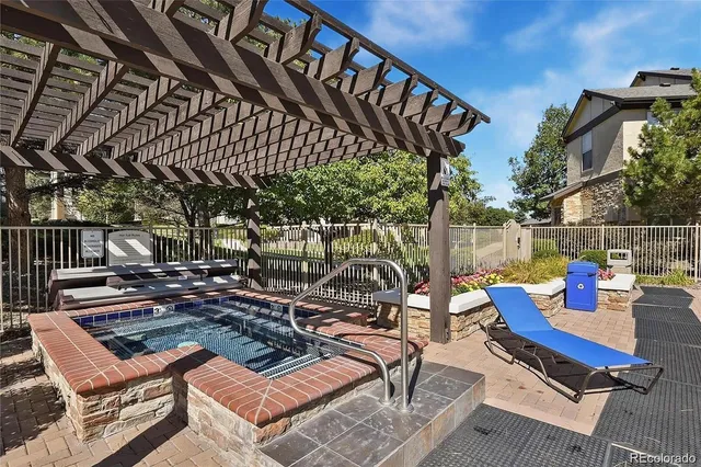 a view of a chairs and table in a patio