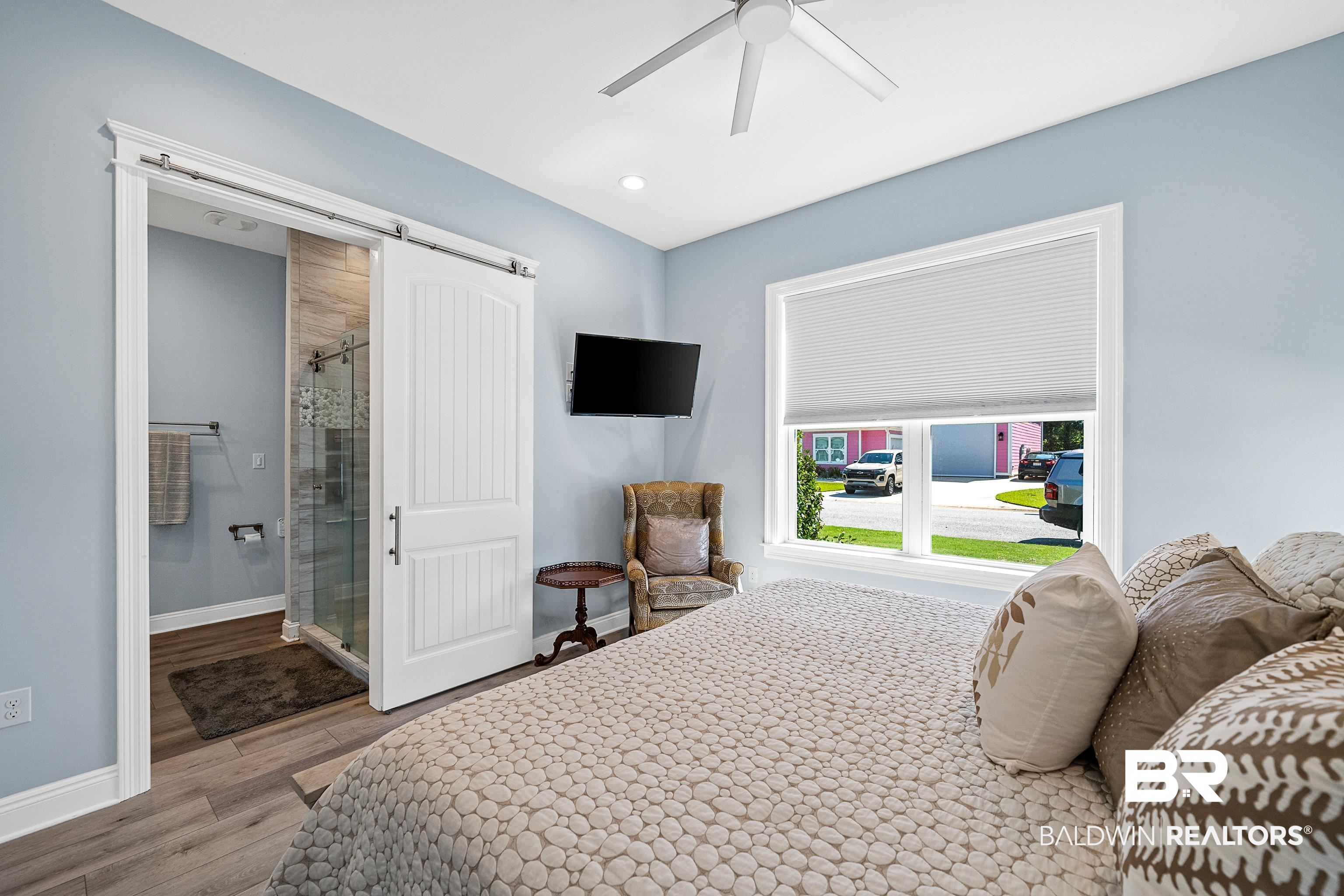 12329 Reunion Place, Unit LOT 38 Foley, AL 36535 - Photo 15 of 43 Bedroom featuring a barn door, light wood finished floors, ensuite bath, ceiling fan, and recessed lighting