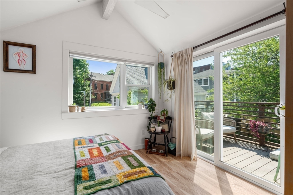 67 Dudley Street, Unit SF Boston, MA 02119 - Photo 21 of 28 a bedroom with furniture and a window