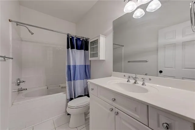 a view of an empty room and wooden floor