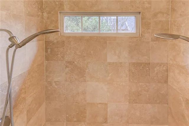 a view of a water fountain in the middle of a yard