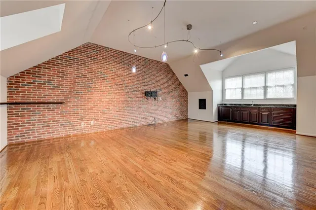 a living room with furniture a rug and a chandelier