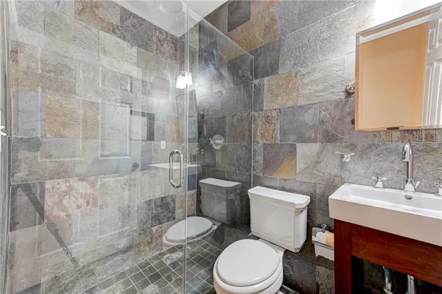 a dining room with furniture wooden floor a rug and a chandelier