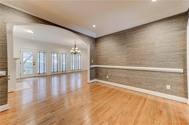 a view of a room with an empty room and kitchen view