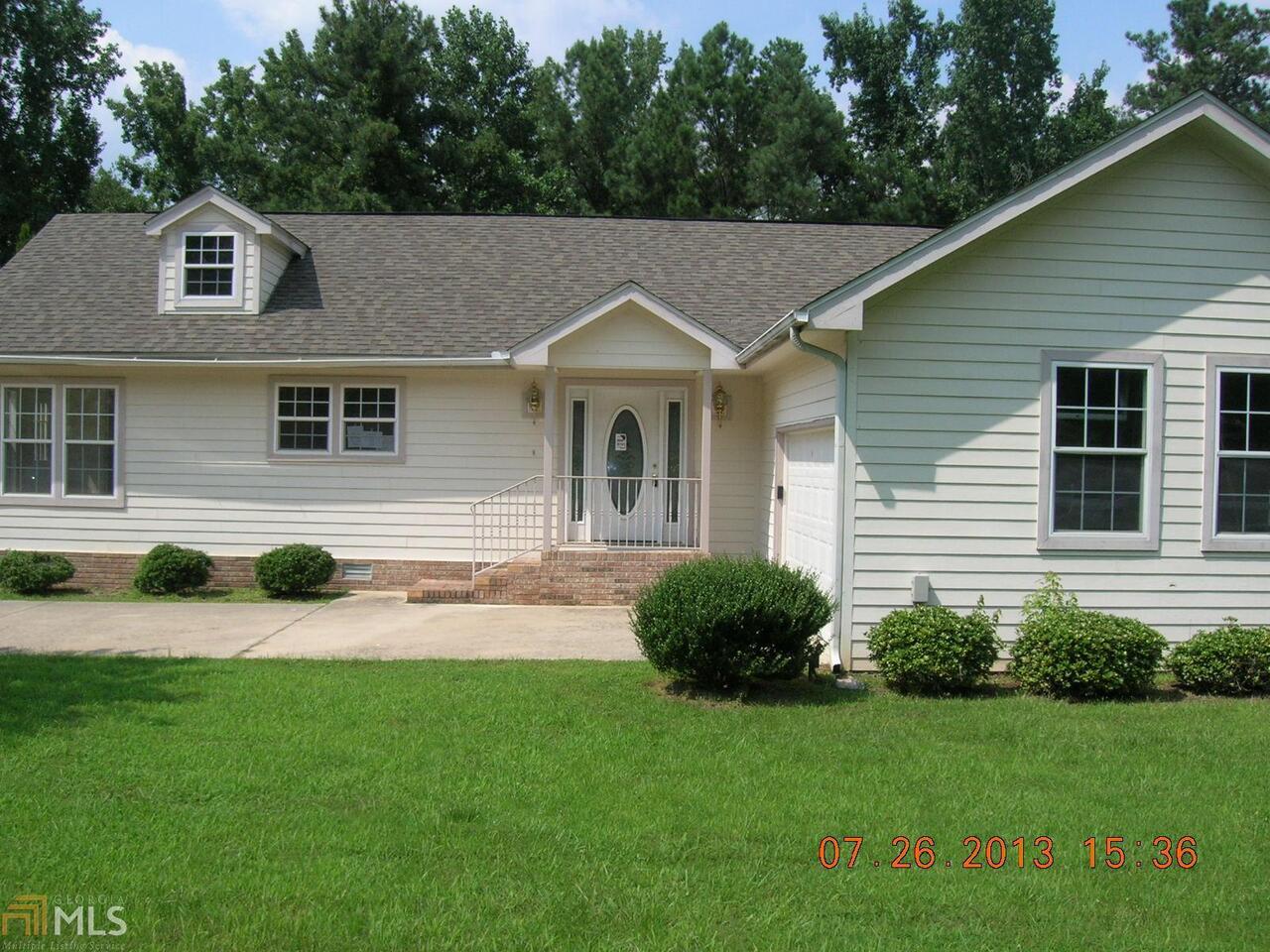 515 Hunnicut Road Southeast Mableton, GA 30126 - Photo 1 of 1 a aerial view of a house with a yard and plants