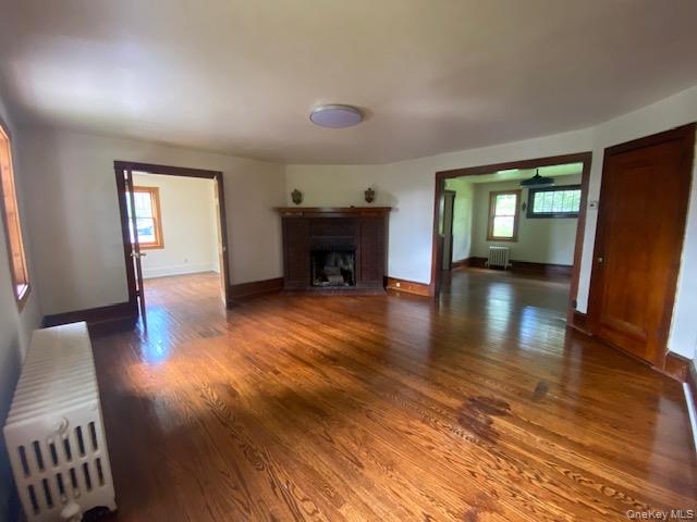72 North Liberty Drive, Unit 1 Stony Point, NY 10980 - Photo 2 of 8 wooden floor in an empty room with a window