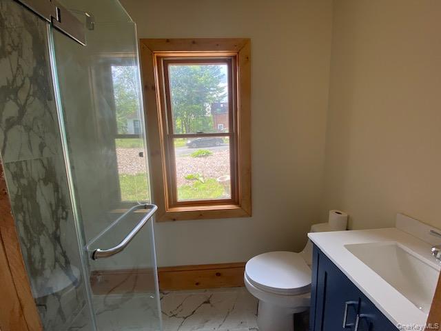 72 North Liberty Drive, Unit 1 Stony Point, NY 10980 - Photo 7 of 8 a bathroom with a toilet sink and window