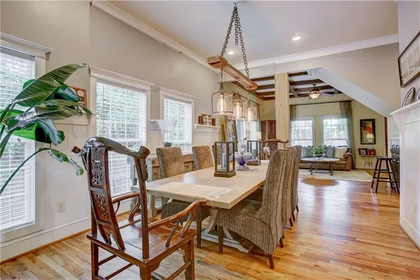 a view of a dining room with furniture window and wooden floor