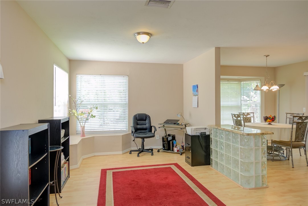 18265 Sycamore Road Fort Myers, FL 33967 - Photo 11 of 29 a very nice looking dining room with a large window and a couch