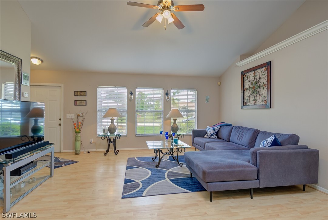 18265 Sycamore Road Fort Myers, FL 33967 - Photo 4 of 29 a living room with furniture and a flat screen tv