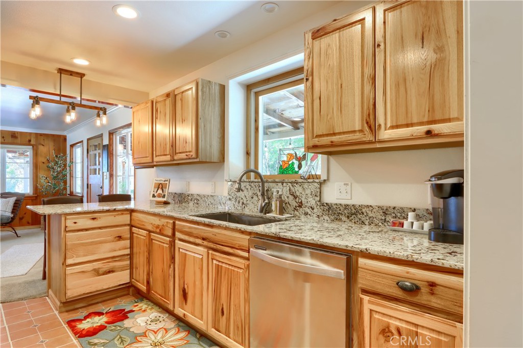 5641B Darrah Road Mariposa, CA 95338 - Photo 11 of 55 a kitchen with stainless steel appliances granite countertop a sink and cabinets