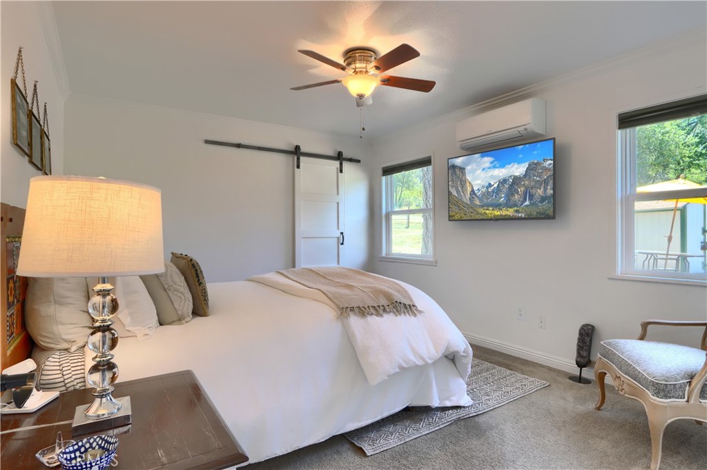 5641B Darrah Road Mariposa, CA 95338 - Photo 17 of 55 a bedroom with bed and a window