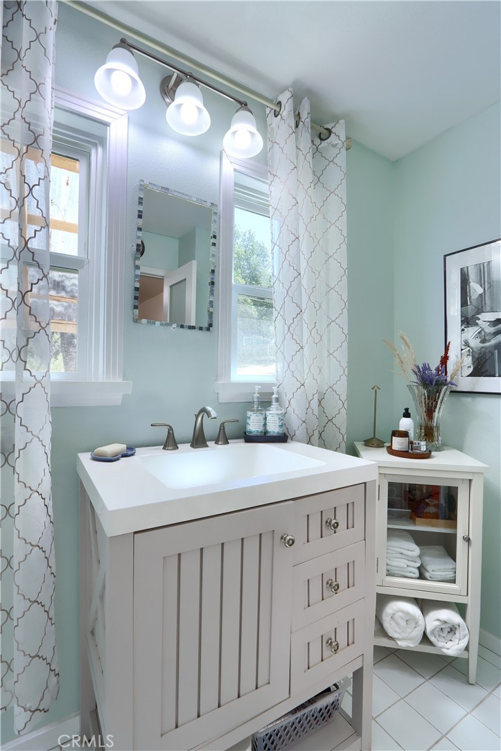 5641B Darrah Road Mariposa, CA 95338 - Photo 19 of 55 a bathroom with a sink vanity and a mirror