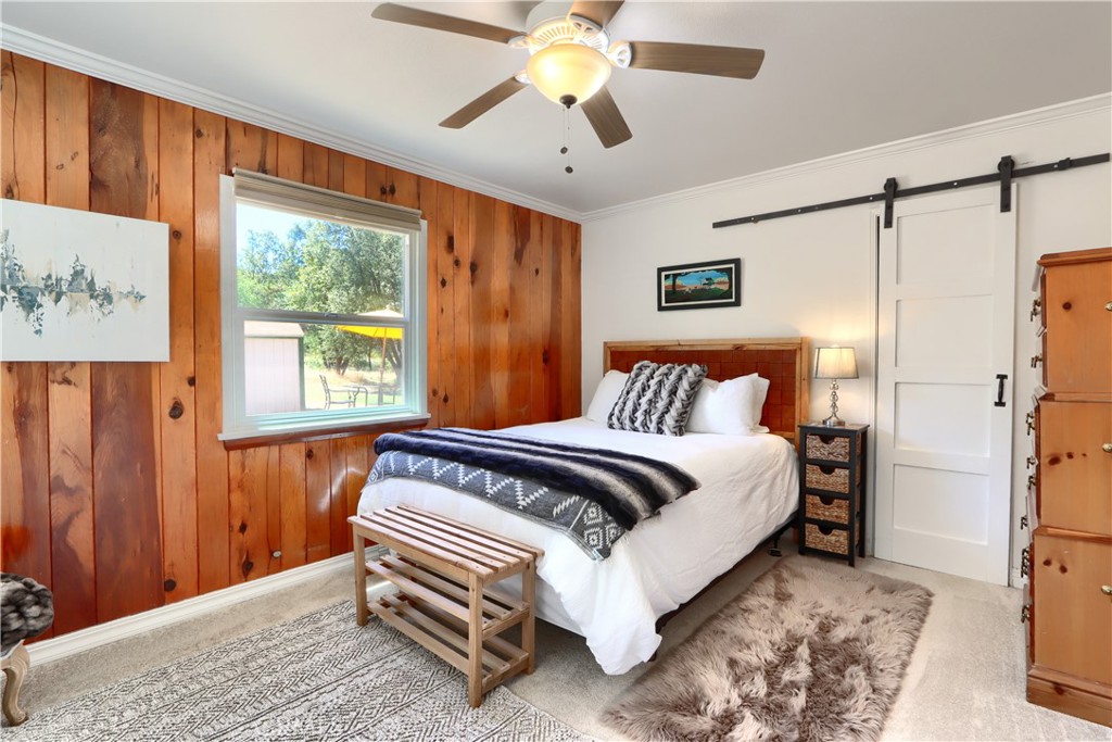 5641B Darrah Road Mariposa, CA 95338 - Photo 21 of 55 a bedroom with a bed and a window