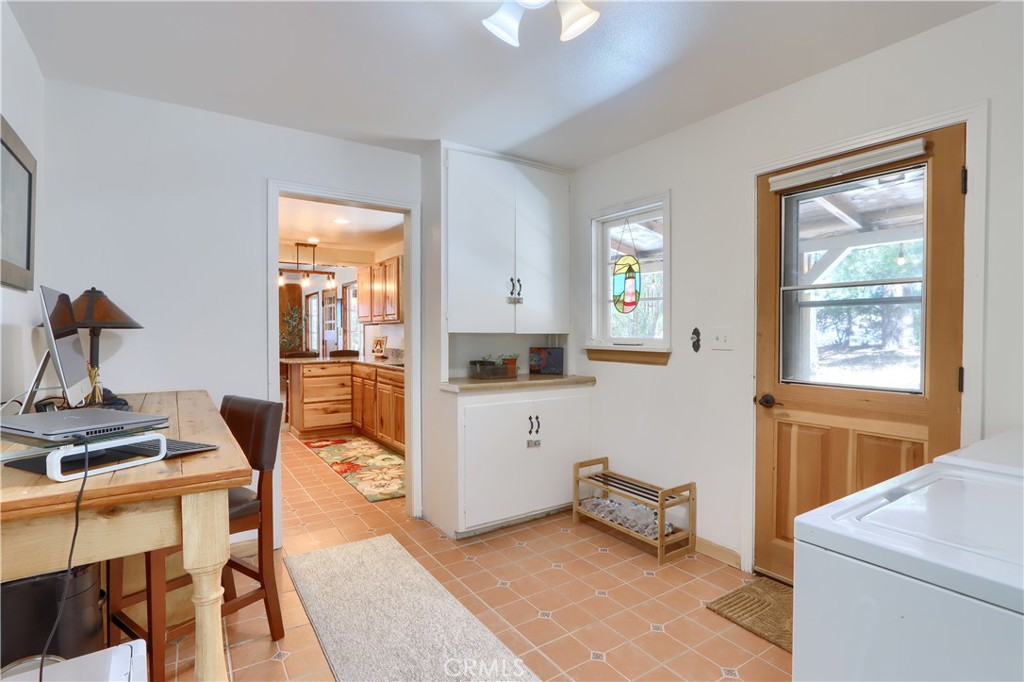5641B Darrah Road Mariposa, CA 95338 - Photo 26 of 55 a kitchen with a refrigerator and a stove top oven