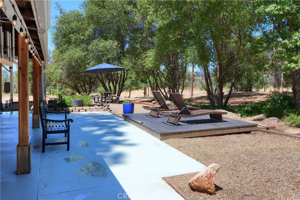 5641B Darrah Road Mariposa, CA 95338 - Photo 27 of 55 a view of a swimming pool with a patio