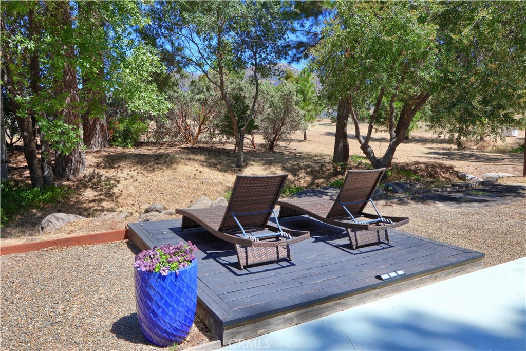 5641B Darrah Road Mariposa, CA 95338 - Photo 28 of 55 a view of a backyard with chair and table on the patio