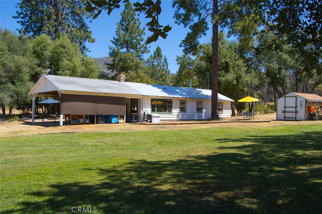 5641B Darrah Road Mariposa, CA 95338 - Photo 37 of 55 a front view of a house with swimming pool having outdoor seating