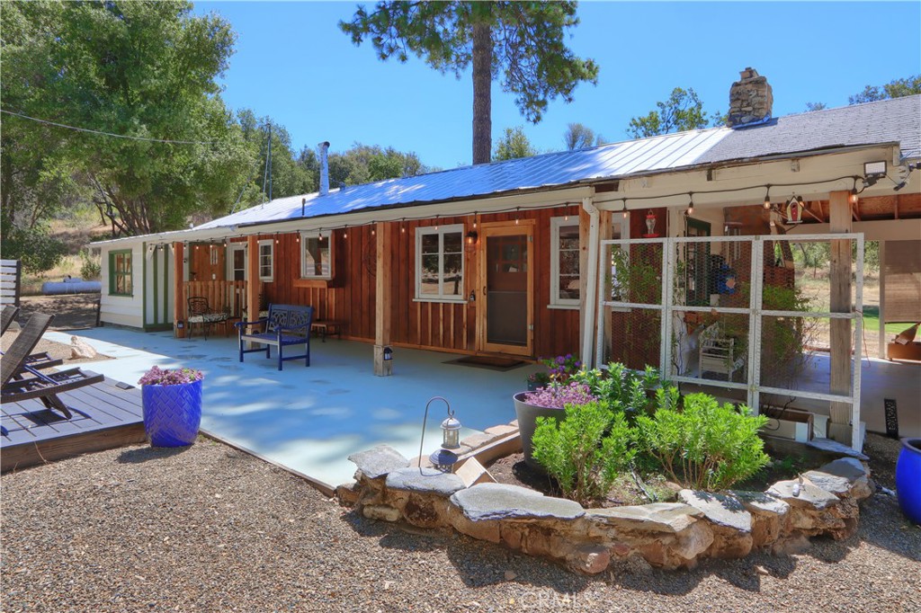 5641B Darrah Road Mariposa, CA 95338 - Photo 4 of 55 a view of a house with sitting area and garden