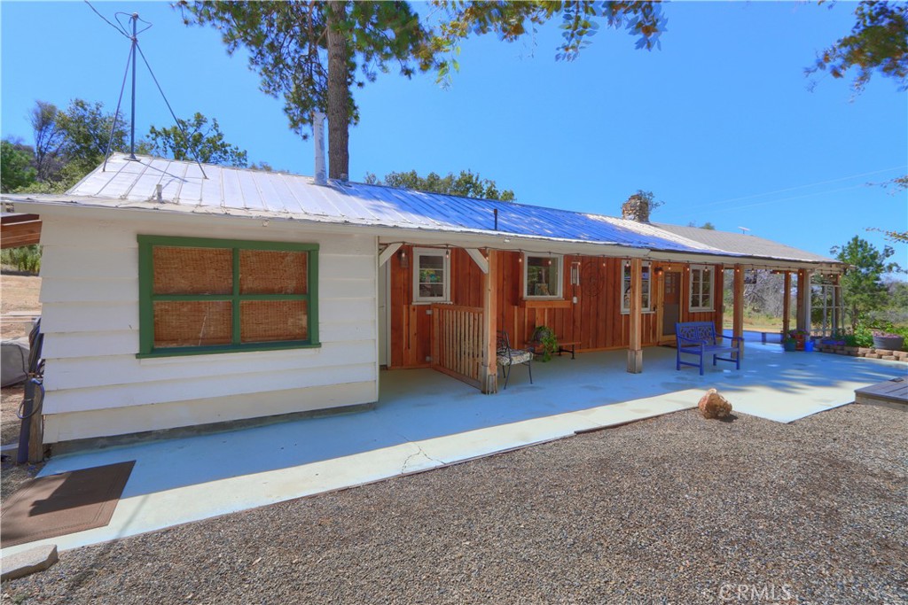 5641B Darrah Road Mariposa, CA 95338 - Photo 41 of 55 a view of a house with a balcony and tree s