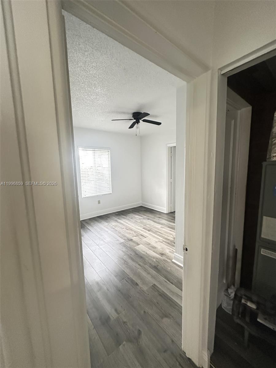 4232 Northwest 2nd Terrace, Unit A Miami, FL 33126 - Photo 11 of 11 wooden floor in an empty room